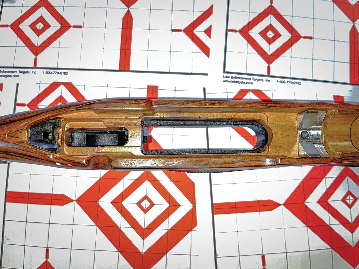 The beautiful walnut stock included bedding blocks at the front action screw and recoil lug, and under the action tang. Aluminum pillars extended through the stock to surround the hex-head action bolts.